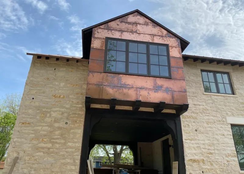 Copper metal panel facade on a stone building for Metal Roof Coating in Wheaton