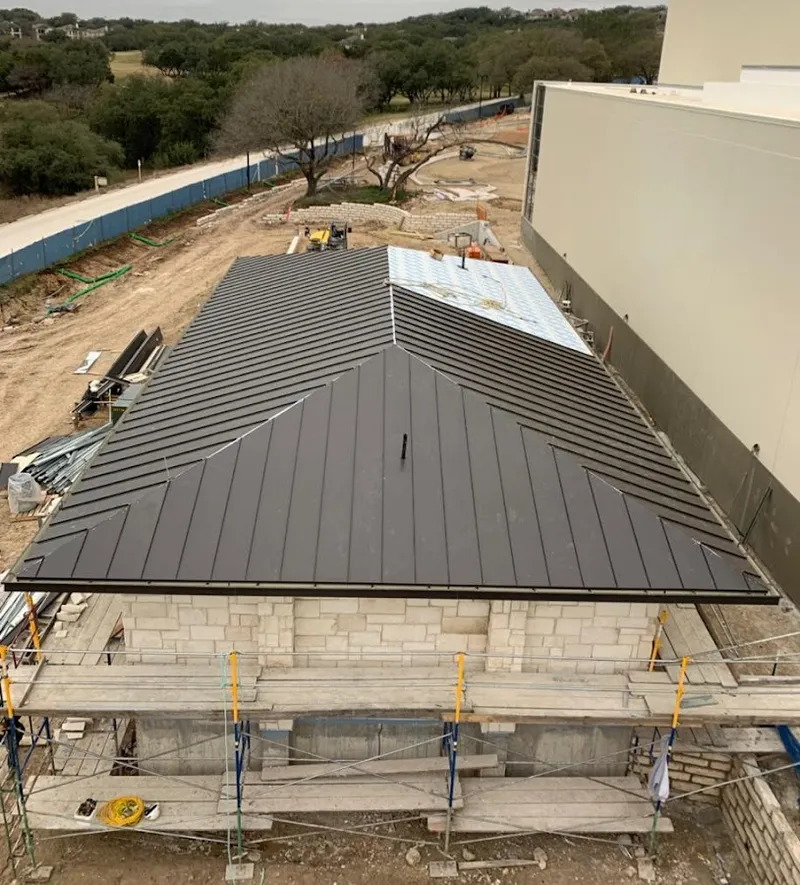 Metal roof new construction with scaffolding in Wheaton